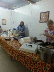 Volunteers setting up to serve hot lunch at Pantry